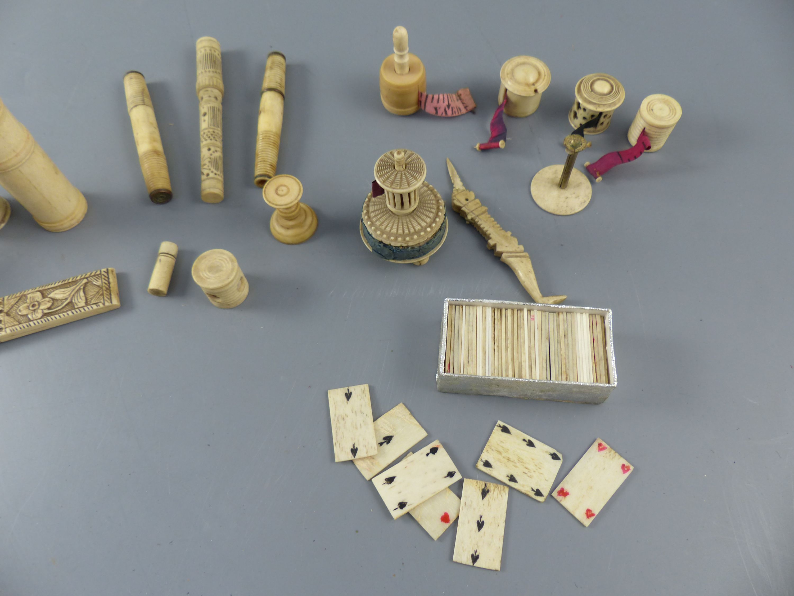 A collection of assorted 19th century bone sewing implements and objets dart